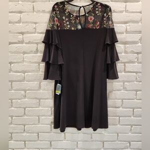 Gabby Skye blsck dress with sheer top with embroidered flowers. 14